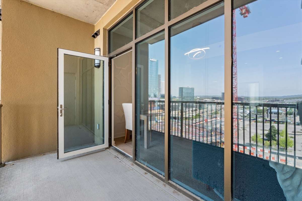 Large outdoor balcony with storage closet