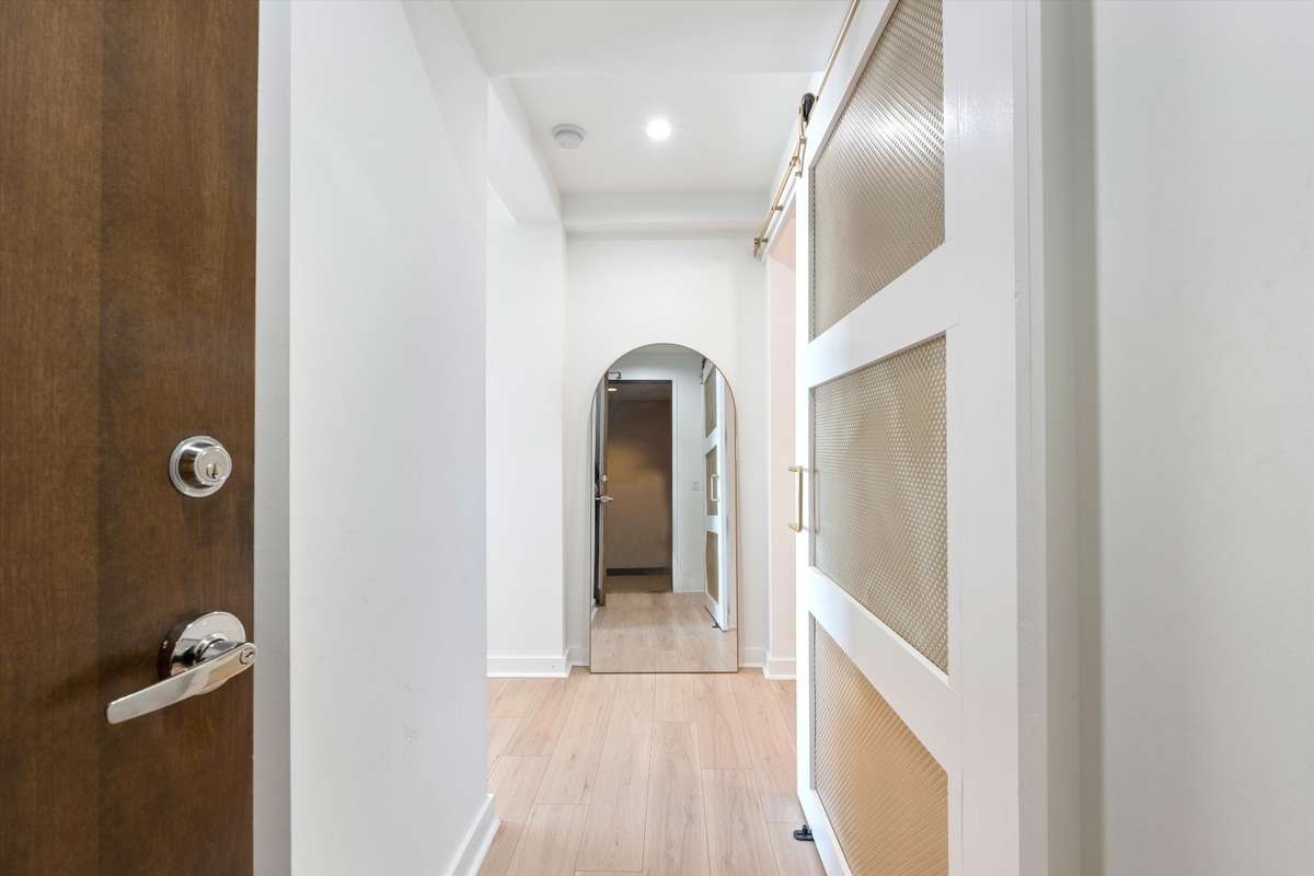 Upon entering you will fall in love the new LVP flooring and custom designed sliding door to bedroom!!