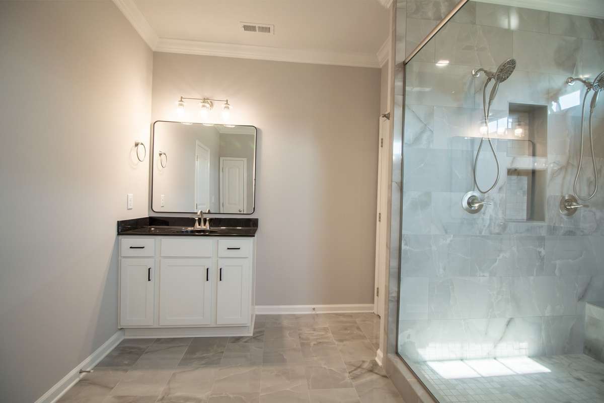 2 Separate Vanities and a Toilet Room!
