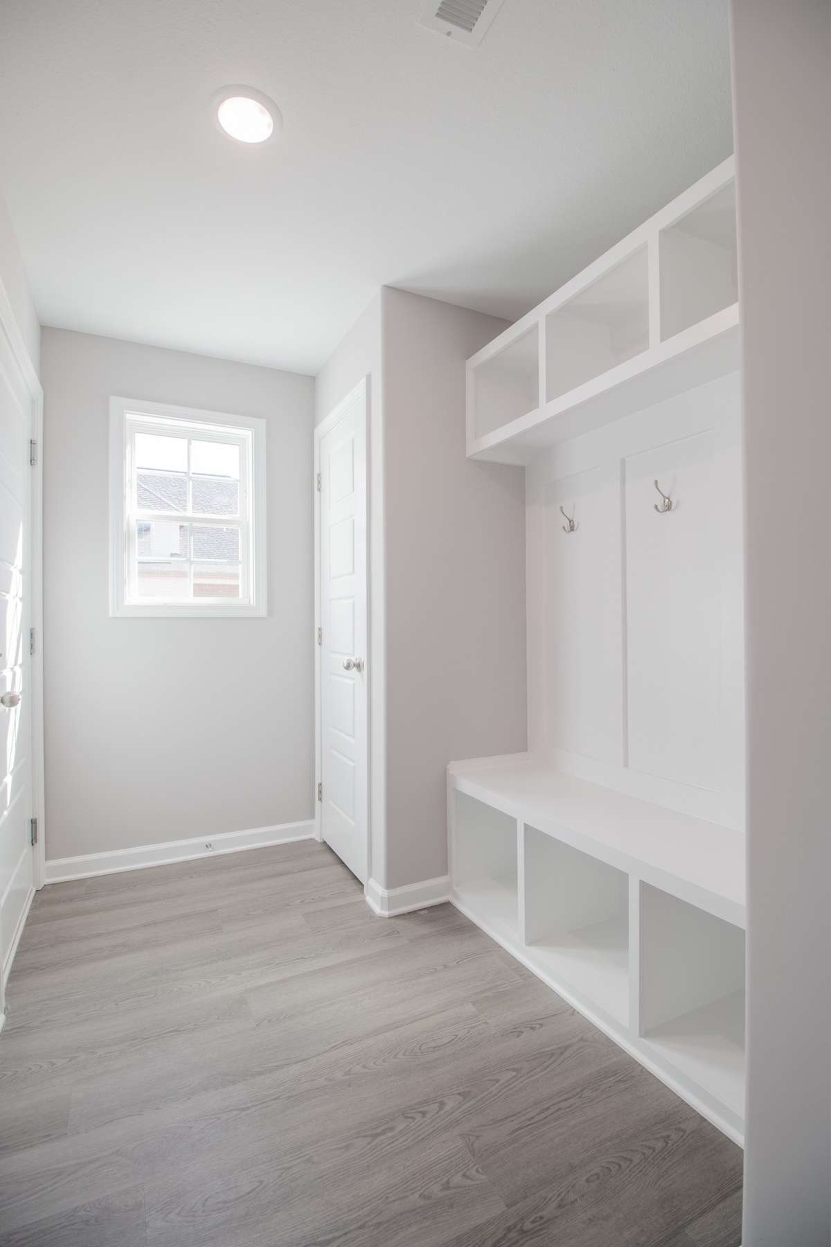 EXAMPLE>>>Mudroom off the Garage with a Built-in Hall Tree and a Closet!