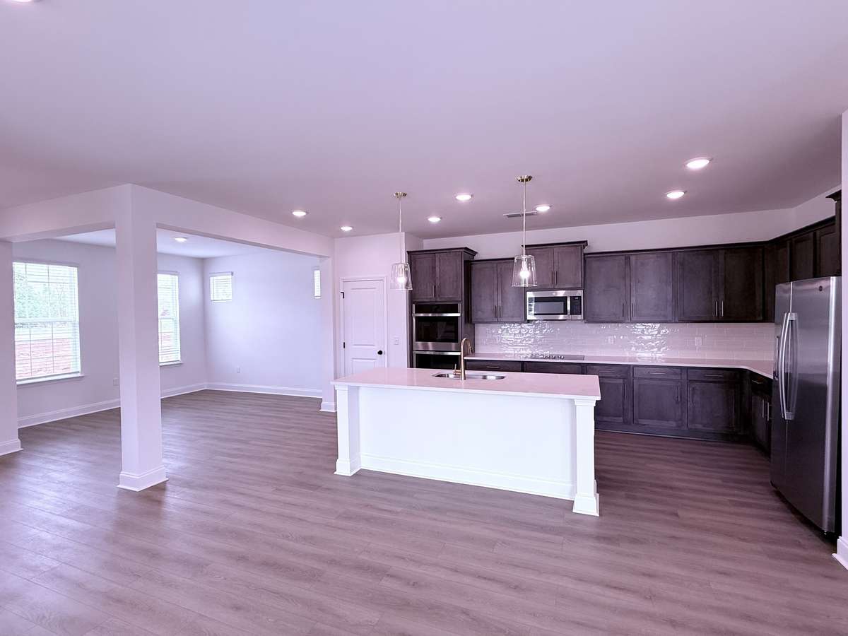 ***Picture taken on 4/1/26 to show the current status of construction***

Alongside the kitchen island’s bar seating for everyday meals, a nearby formal dining room creates the perfect atmosphere for memorable dinner gatherings.
