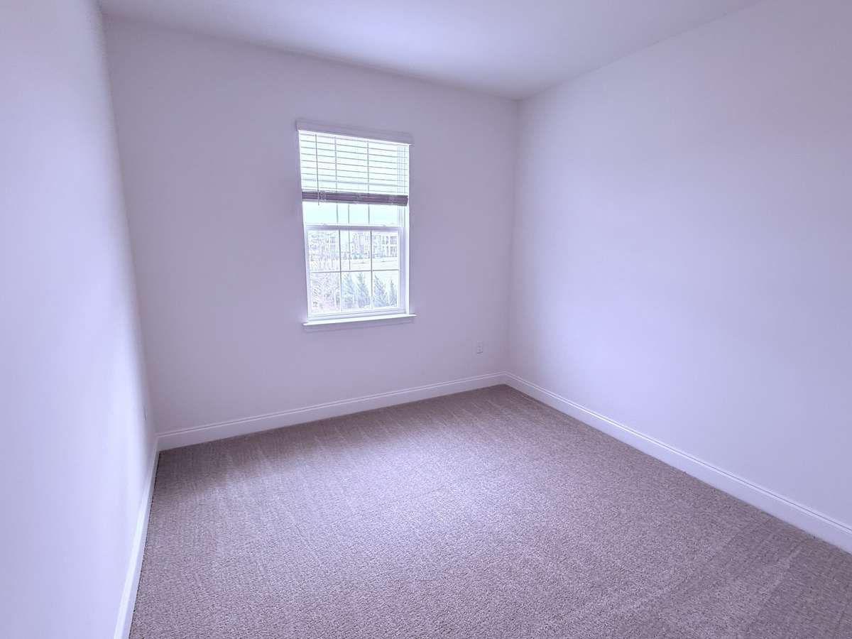***Picture taken on 4/1/26 to show the current status of construction***

Bedroom 3 is situated upstairs with the primary suite and Bedroom 2, alongside a loft and covered balcony, creating a spacious second-floor layout.