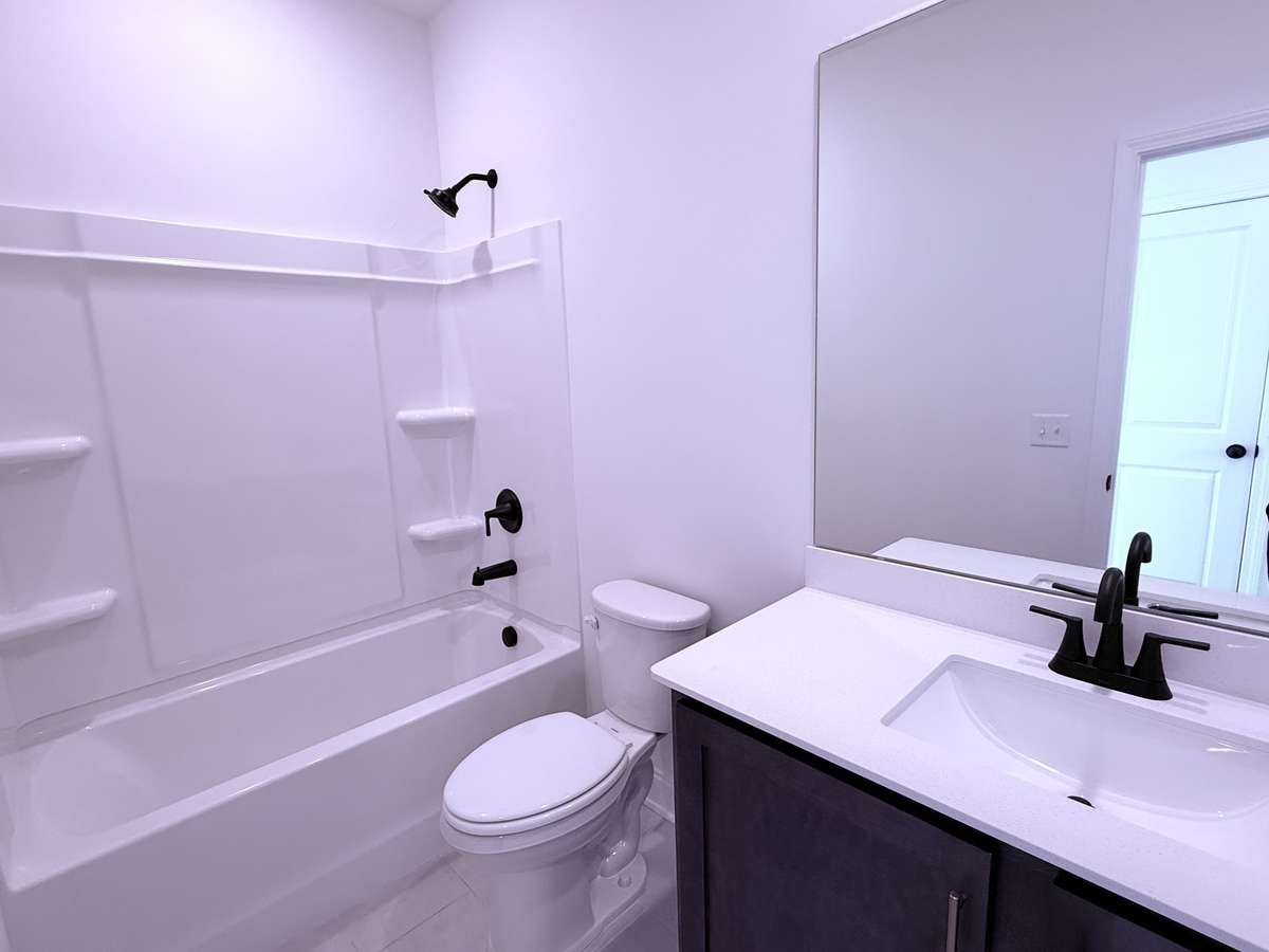 ***Picture taken on 4/1/26 to show the current status of construction***

Bath 2, located on the 2nd floor, includes tile flooring and quartz countertops.