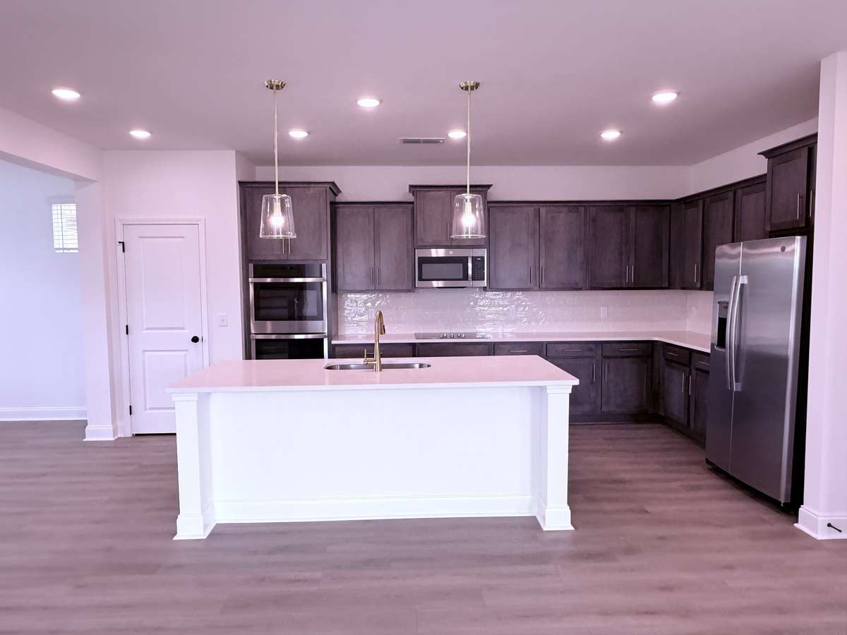 ***Picture taken on 4/1/26 to show the current status of construction***

Quartz countertops and a subway tile backsplash complete the kitchen, offering a clean, timeless look with lasting durability.