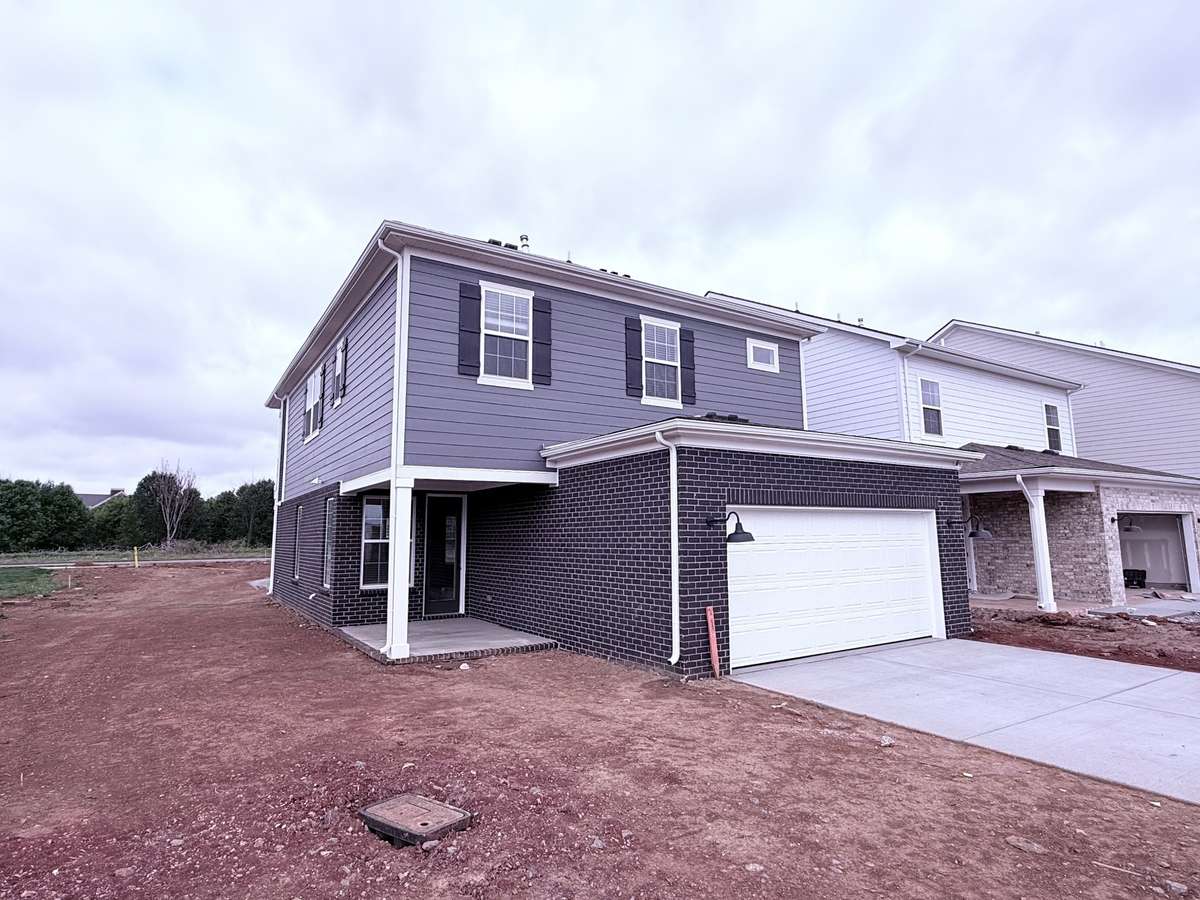 ***Picture taken on 4/1/26 to show the current status of construction***

In addition to the 23' x 20' garage, you’ll enjoy two driveway parking spaces. A tankless water heater, located in the garage, adds to the home’s comfort and efficiency.