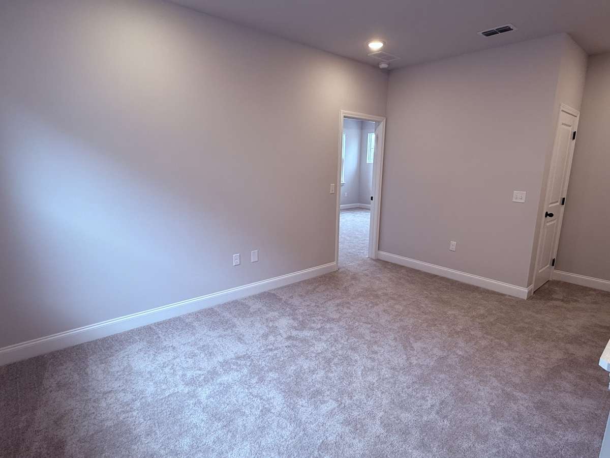 A small loft on the second floor adds extra versatility, serving as a cozy reading nook, homework area, or additional lounge space to complement the bedrooms.