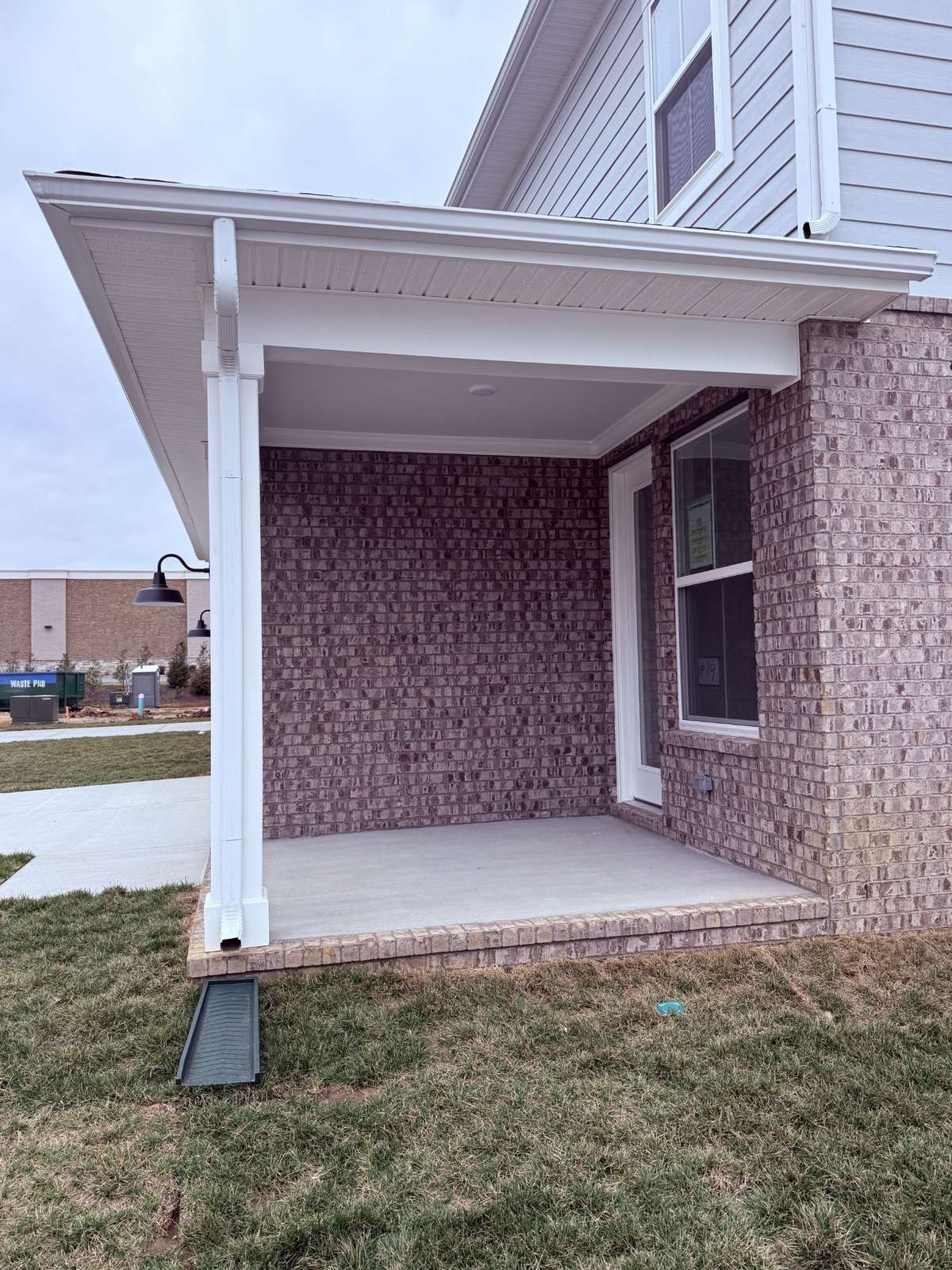 A covered rear patio, accessible directly from the sunroom, provides the perfect space for indoor/outdoor relaxation, entertaining, or enjoying your morning coffee.