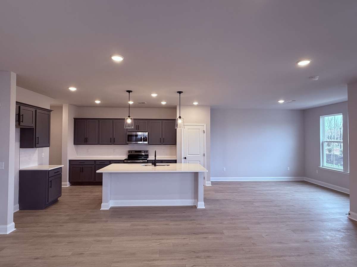 The kitchen flows seamlessly into the 13' x 12' dining area, offering plenty of space to host dinner parties and gather with family and friends.