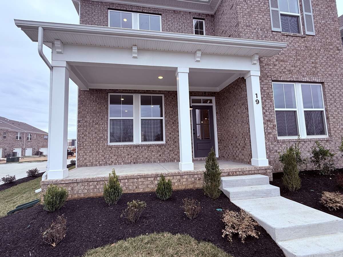 Enjoy morning coffee on the front porch that overlooks the beautifully landscaped dog park and green space!