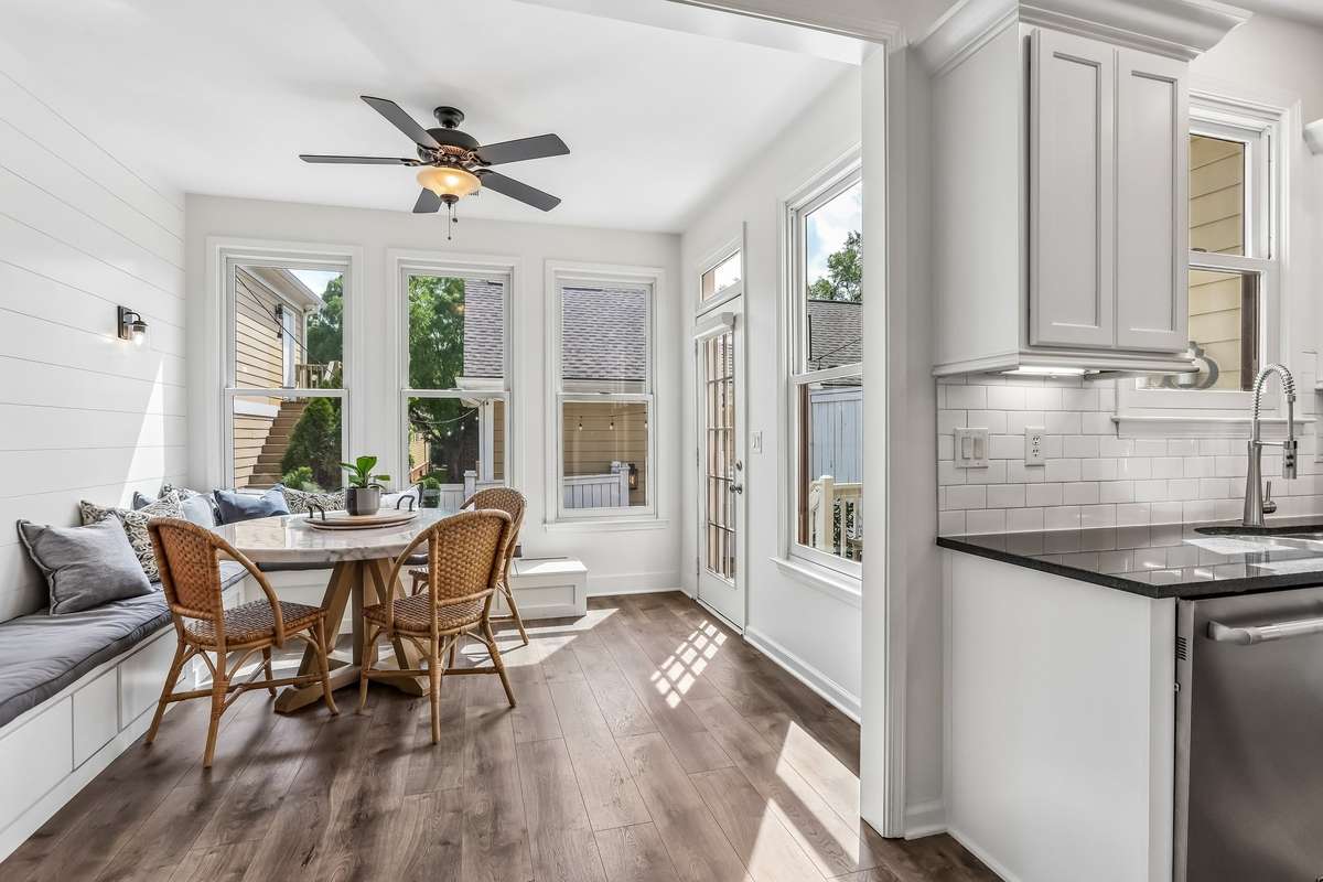 Charming breakfast nook with built-in banquette and abundant natural light.