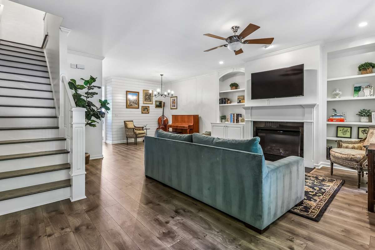 Inviting great room with fireplace and built-n shelving.