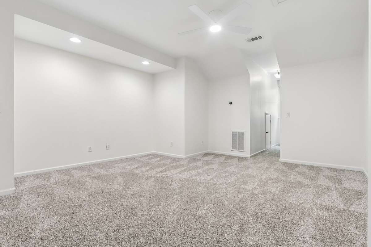 Versatile third-floor room with new carpet and closet. Ideal as a bedroom or bonus space.