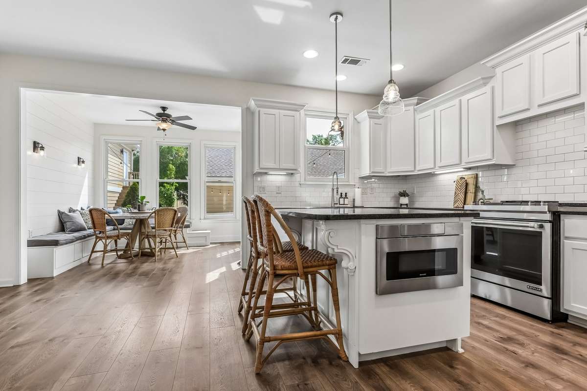 Spacious kitchen with large island seating, perfect for gathering.