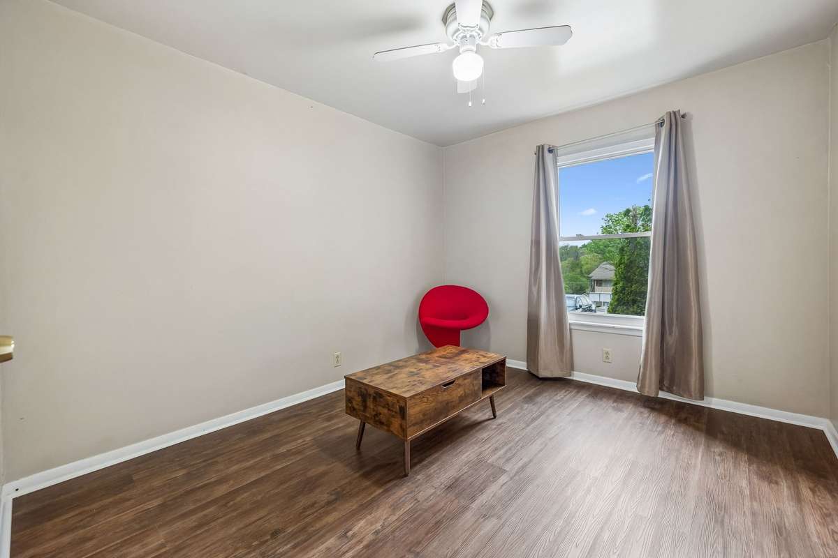 Large secondary bedroom features a lovely view out the window and a large closet