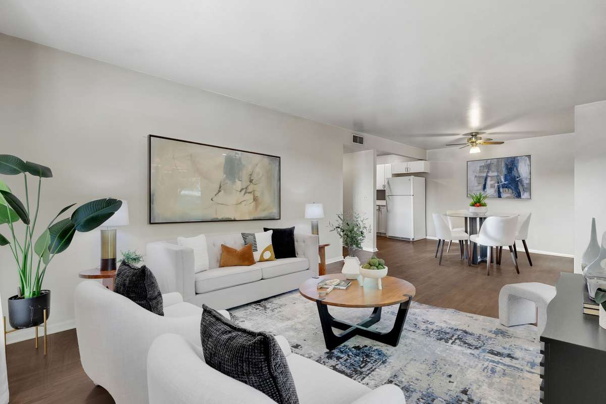 Welcome Home to 809 Ashlawn Place, Nashville, TN!  You will love relaxing in this spacious, light-filled great room open to the large dining area. (Note: this room is virtually staged)