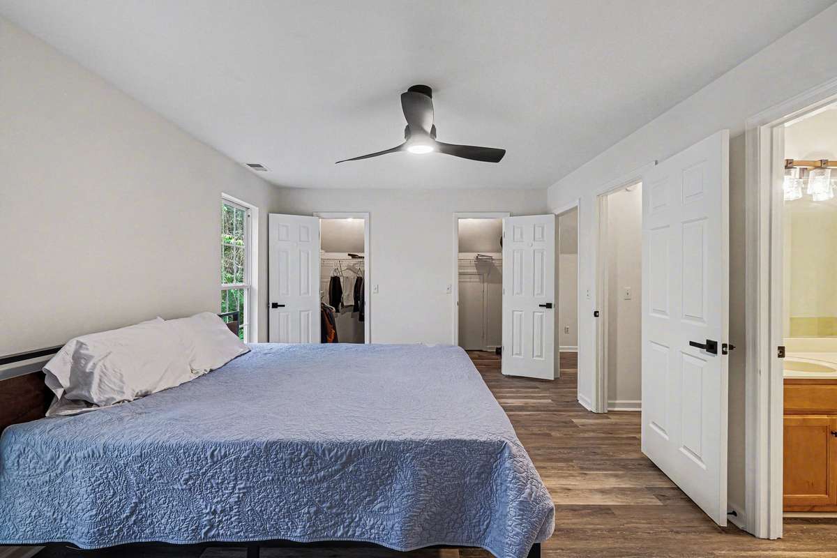 Everything is brand new! From the wide-plank flooring to the stylish light fixtures and hardware, this bedroom is move-in ready. The dual-closet design and en-suite access make this space as functional as it is beautiful.