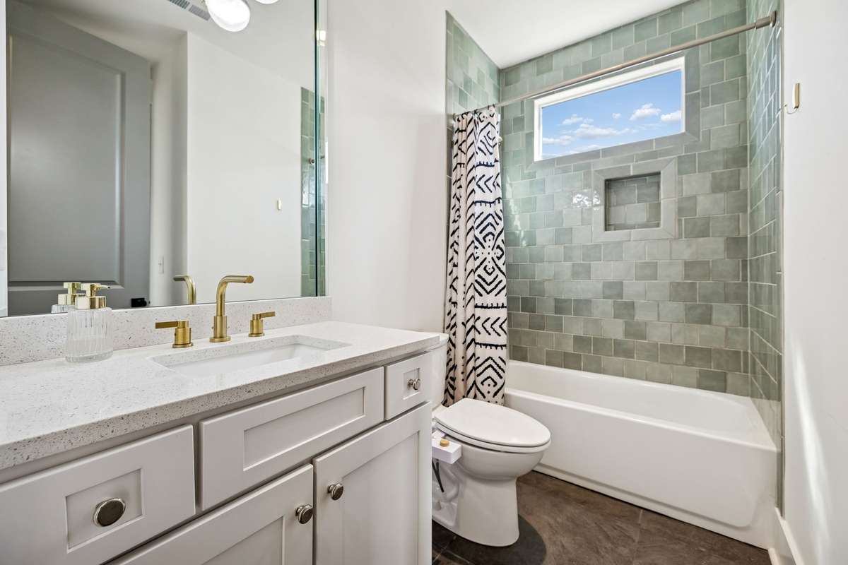 Secondary bathroom attached to the upstairs hallway and one of the secondary bedrooms
