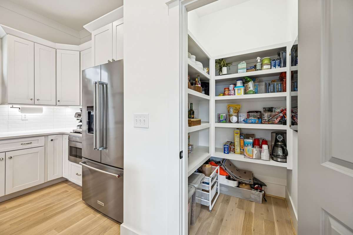 Large, walk-in pantry with built-in shelving