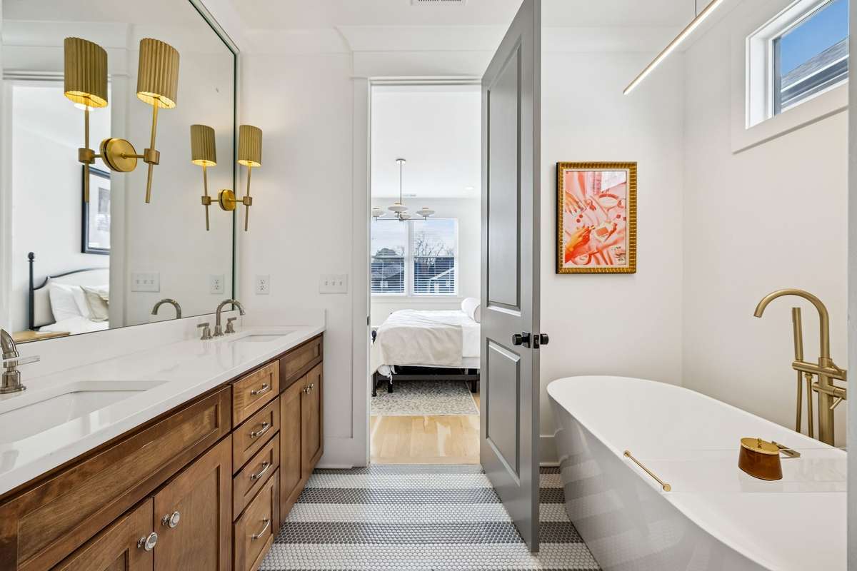 Prepare for the day or unwind in the spa-inspired primary bathroom