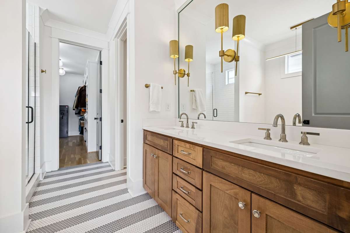 Luxe tile and warm wood finishes