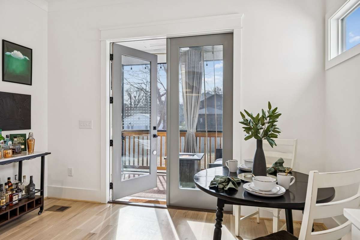 Step outside to the screened-in porch and spacious back yard.