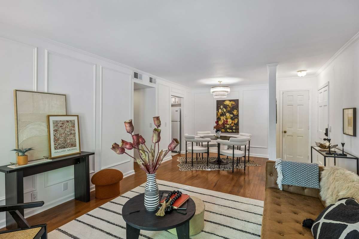 The open and airy living area flows seamlessly into a versatile dining space.