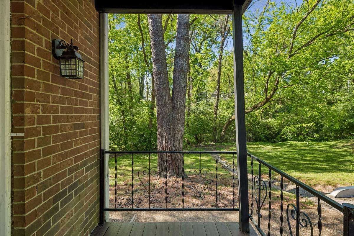 This end-unit is positioned to overlook the community green space, offering extra privacy and a peaceful view right from your patio.
