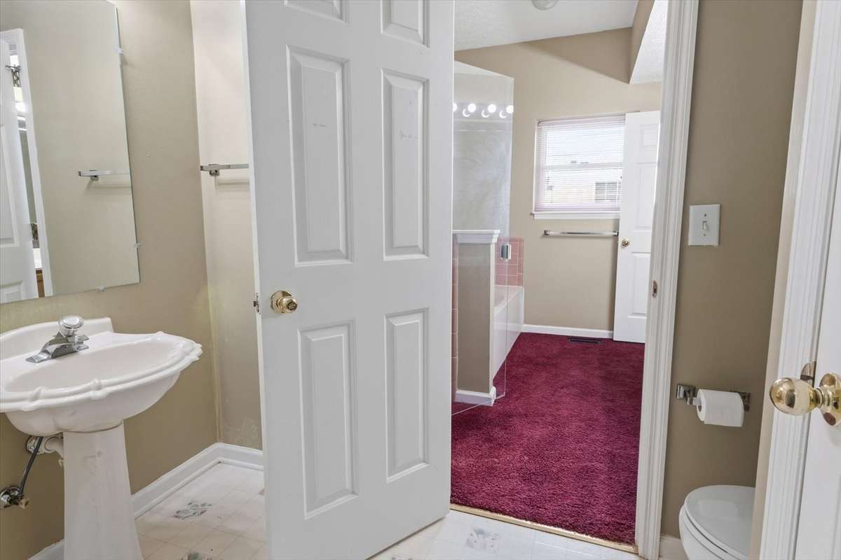 Downstairs Bathroom off of 4th bedroom/second primary bedroom.
