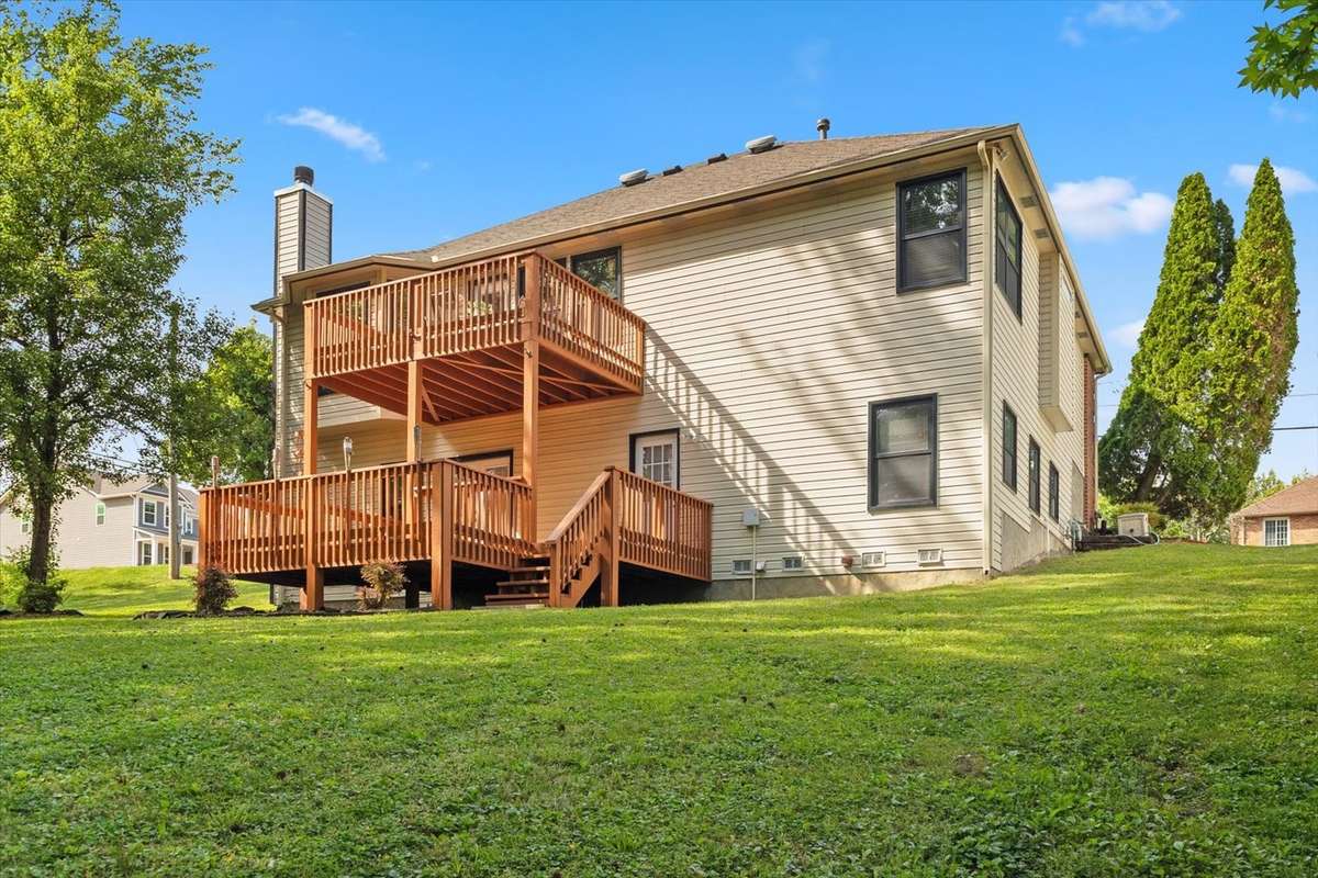Beautiful backyard with large double deck, perfect for entertaining guests.