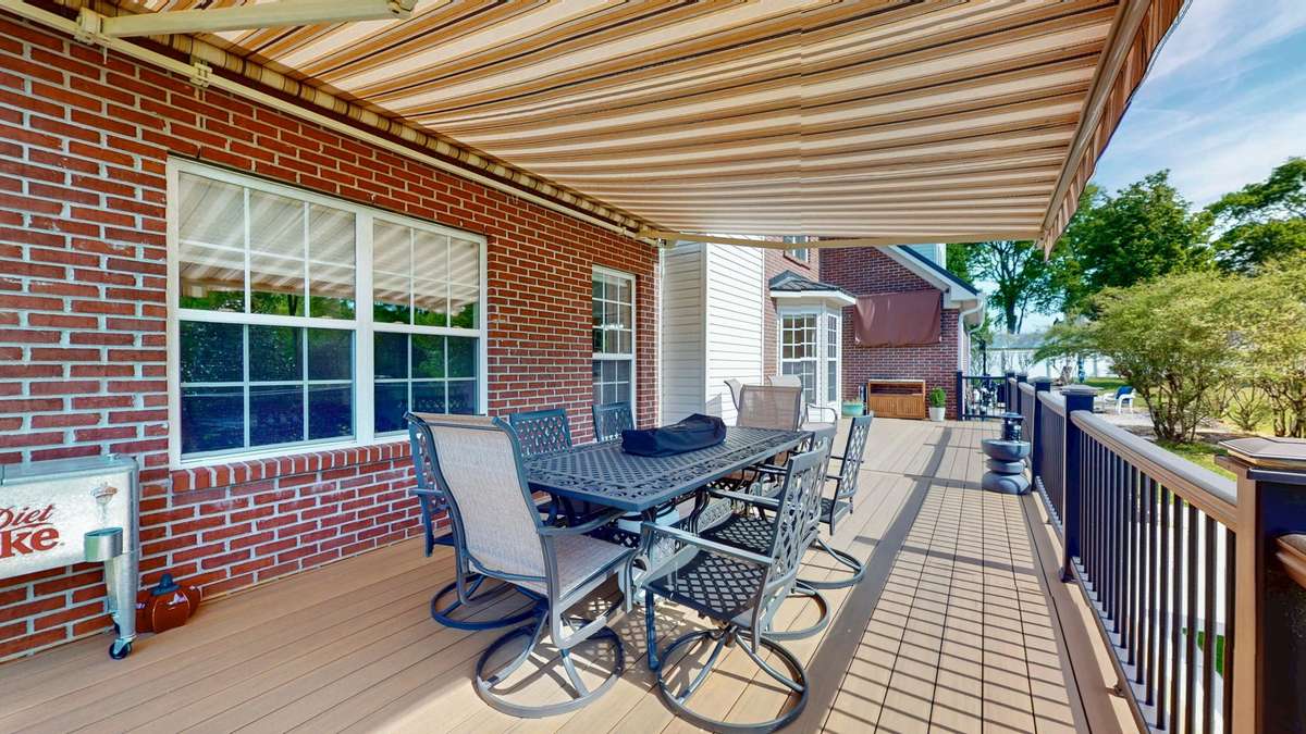 Backyard retreat!  Composite decking and aluminum handrails make this space easy to maintain and gives you more time to relax!  Retractable awing with remote.  **Hot tub does not convey.**
