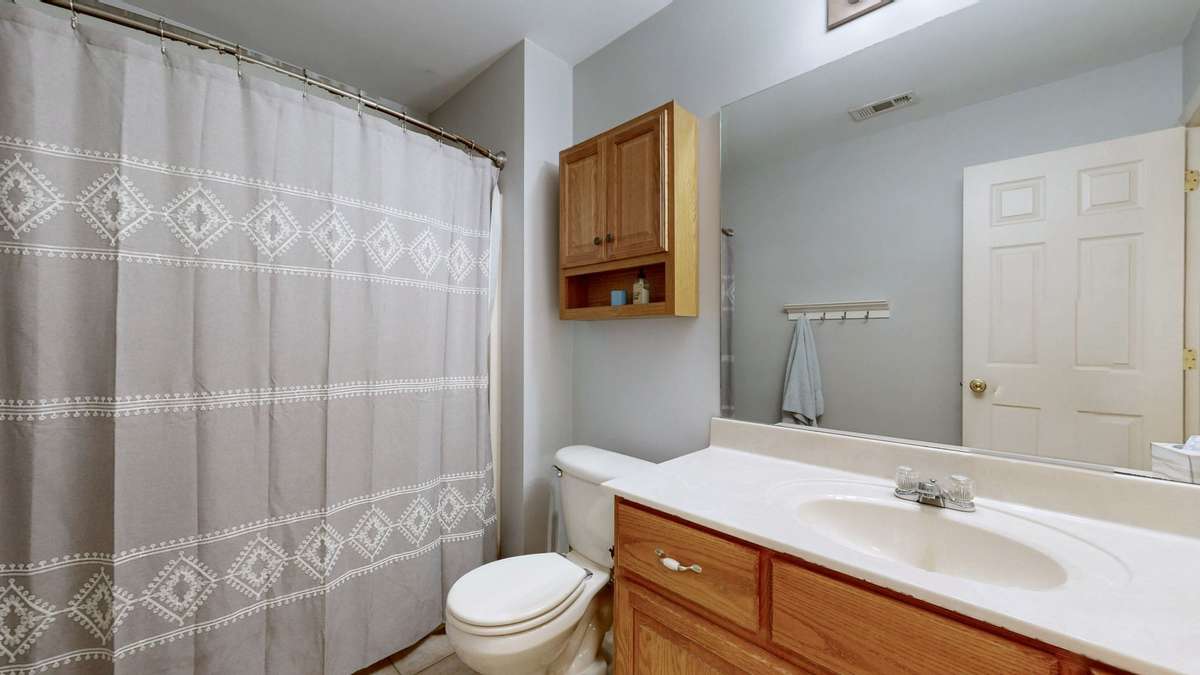 2nd level bathroom with tub/shower combo.
