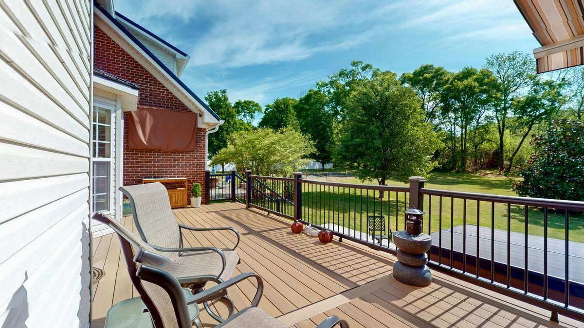Backyard retreat!  Composite decking and aluminum handrails make this space easy to maintain and gives you more time to relax!  Retractable awing with remote.  **Hot tub does not convey.**