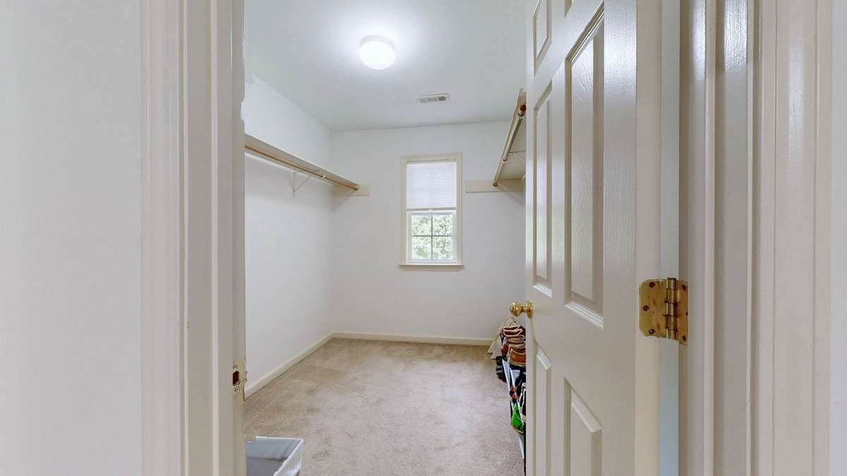 Primary bath with soaking tub, double vanities, separate shower, and huge walk-in closet.