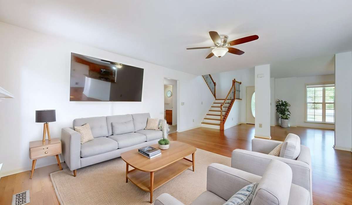 Great room open to kitchen and dining areas.  (virtually staged)