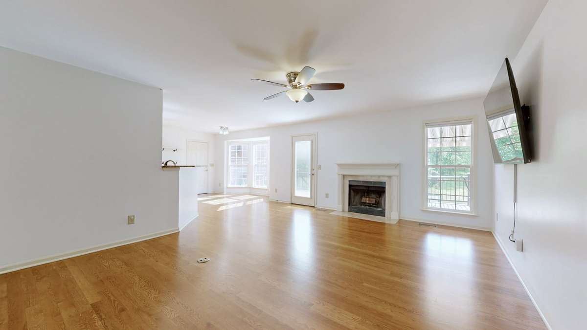 Wood burning fireplace.  Natural lighting surges into the main living areas.