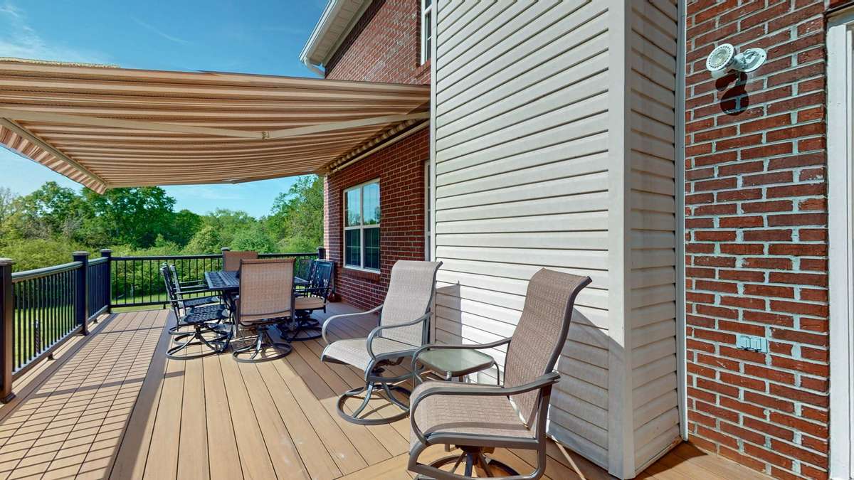 Backyard retreat!  Composite decking and aluminum handrails make this space easy to maintain and gives you more time to relax!  Retractable awing with remote.  **Hot tub does not convey.**