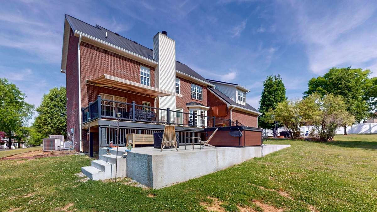 Backyard retreat!  Composite decking and aluminum handrails make this space easy to maintain and gives you more time to relax!  Retractable awing with remote.  **Hot tub does not convey.**