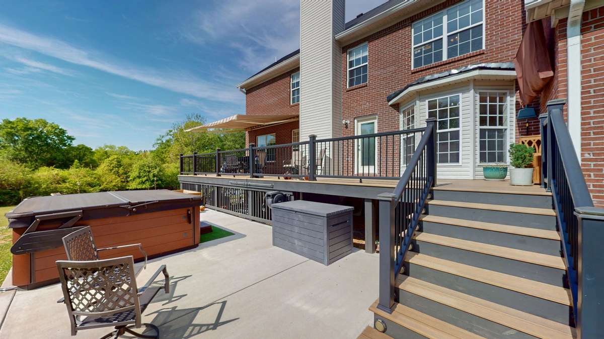 Backyard retreat!  Composite decking and aluminum handrails make this space easy to maintain and gives you more time to relax!  Retractable awing with remote.  **Hot tub does not convey.**