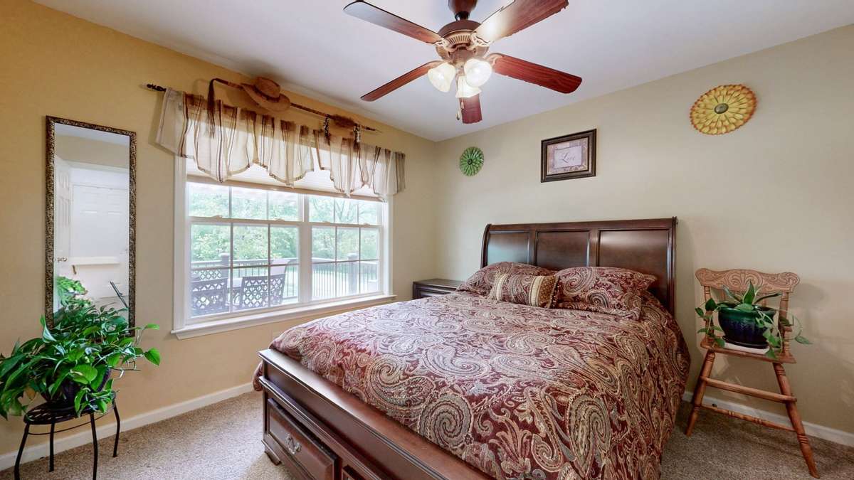 Main level guest bedroom.  GREAT FOR MULTI-GENERATIONAL HOUSEHOLDS!