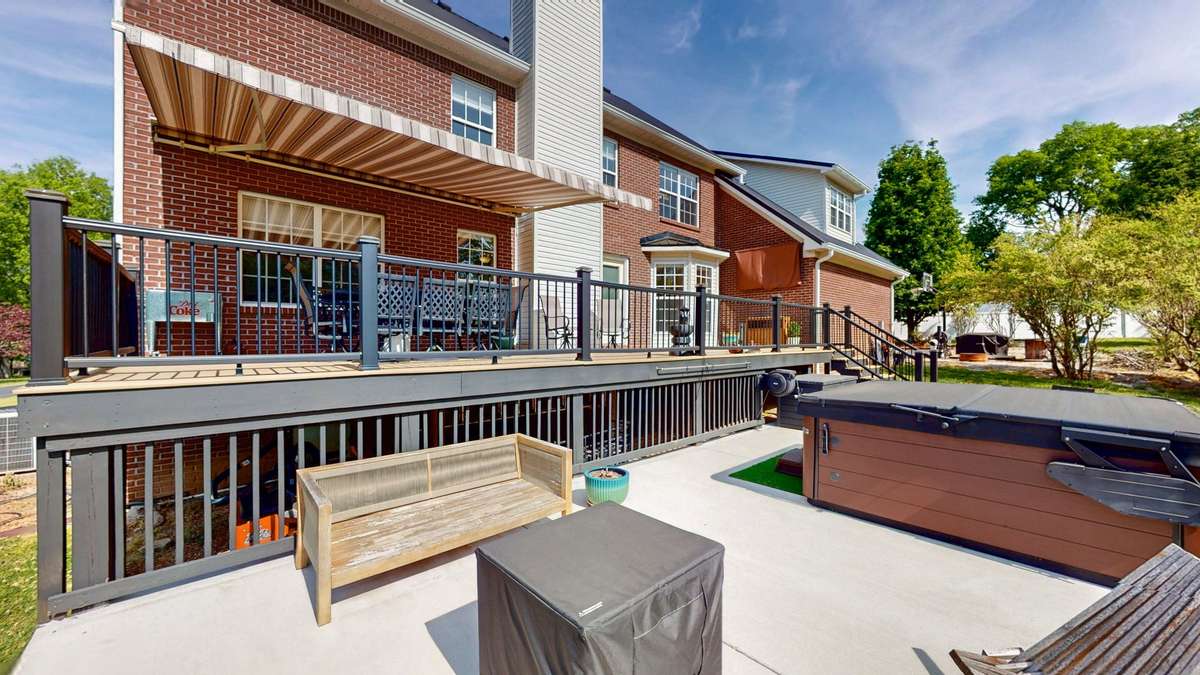 Backyard retreat!  Composite decking and aluminum handrails make this space easy to maintain and gives you more time to relax!  Retractable awing with remote.  **Hot tub does not convey.**