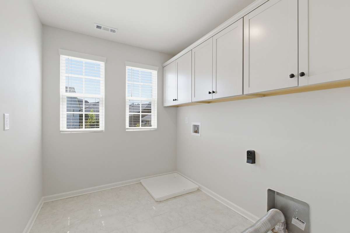 laundry room with washer/dryer hook up and custom cabinetry!
