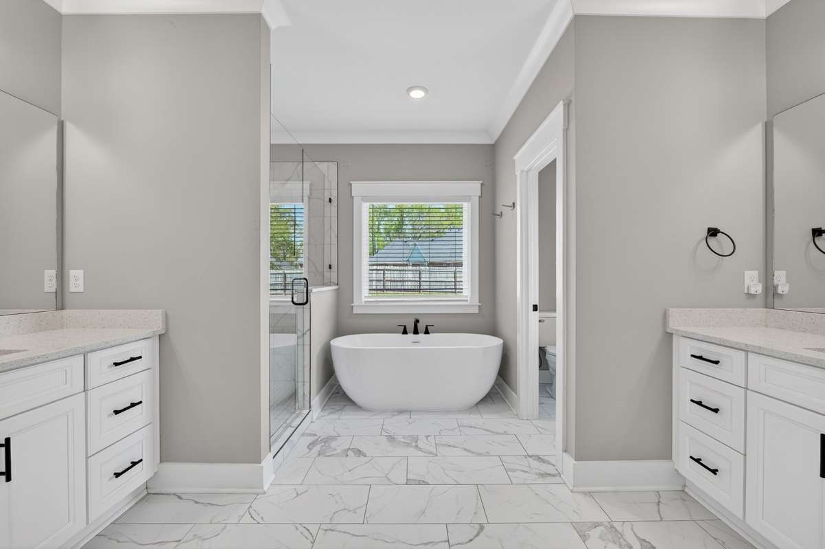 Double vanities, soaking tub, tile shower
