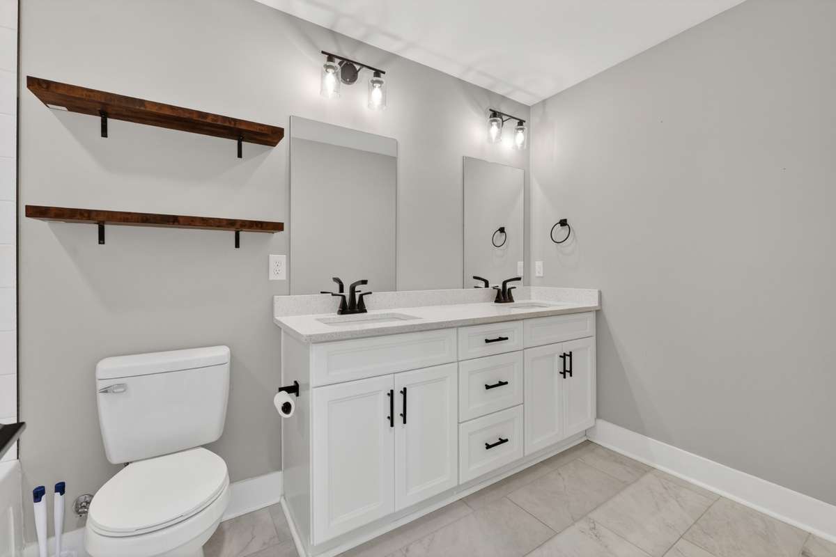 upstairs guest bath features double vanities