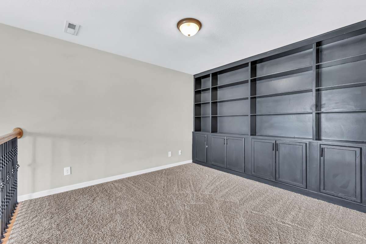 Upstairs loft area with custom built-ins.