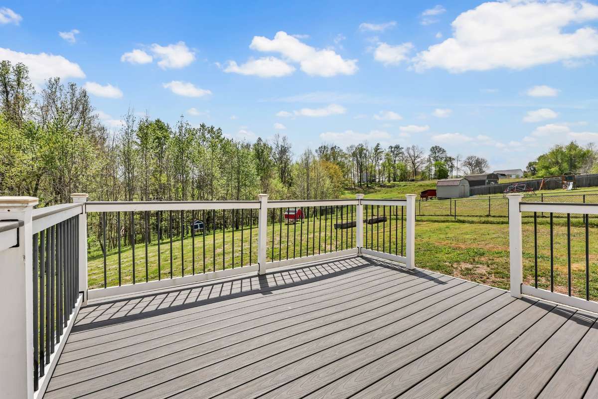 Step out back to a Trex deck + beautiful views!