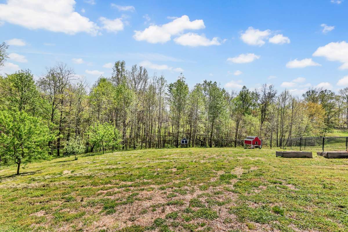 No backyard neighbors + tree lined views!