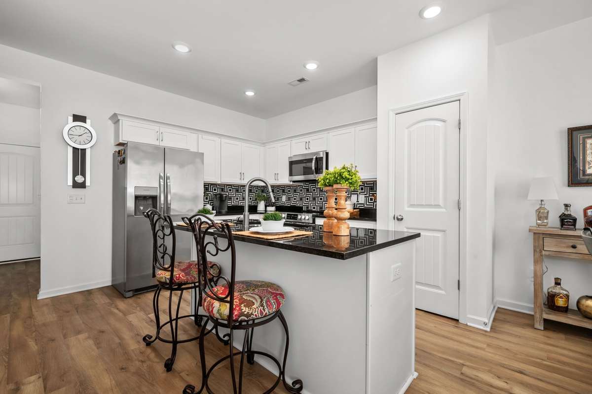 Kitchen pantry for extra storage and additional seating at the island.