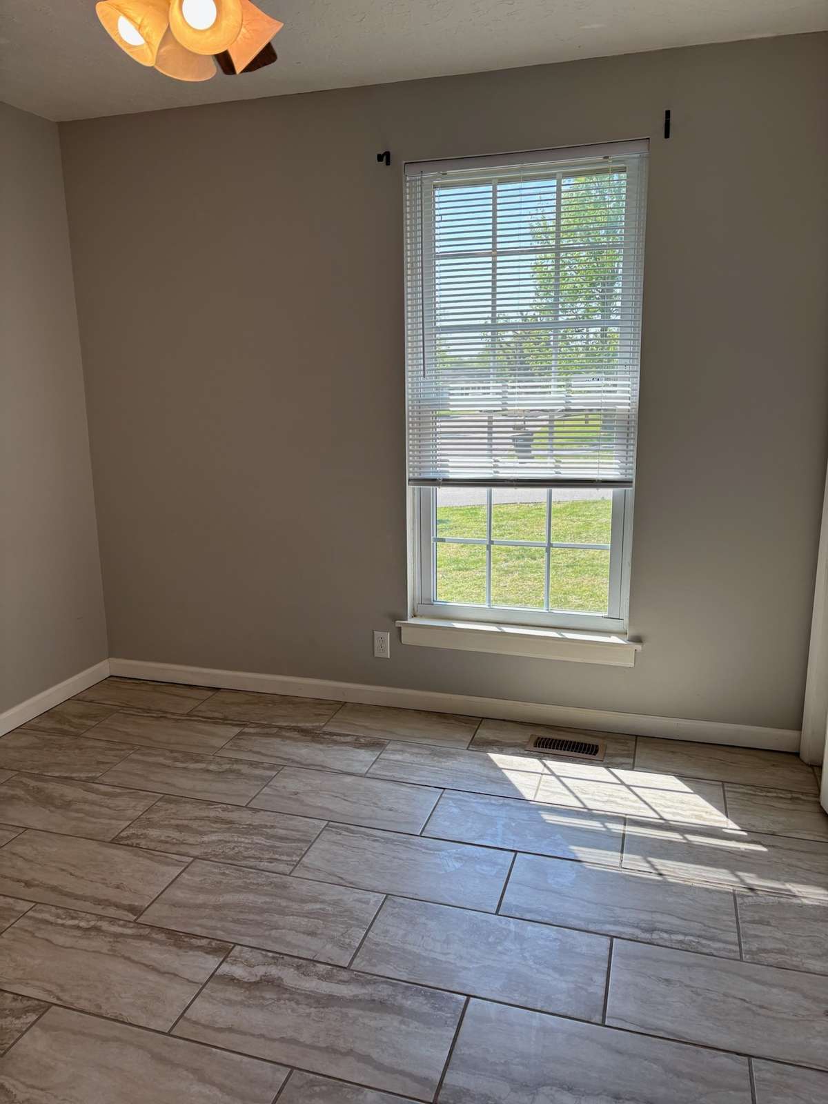 This bedroom was used as an office.  Tile floors and double size closet with selves.