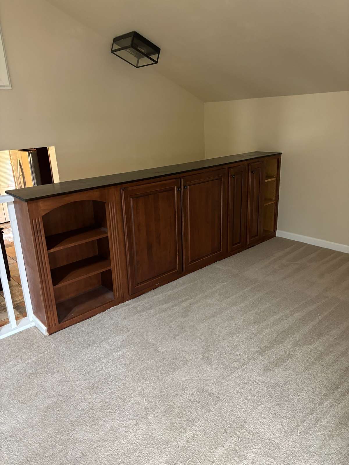 Cabinet storage in bonus room.