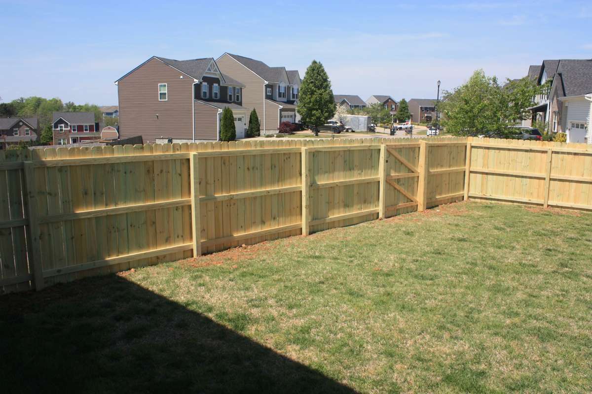 Beautiful new wood fence offers privacy and safety for kids and pets
